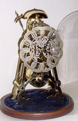Mid 20th Century, English, Passing Strike Skeleton clock in a rafter style frame with engraving on the front plate. — Antique Clocks Price Guide