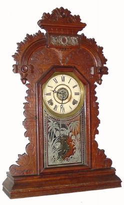 C.1911, E. Ingraham Clock Co., "Ducat", 8-day time/strike/alarm oak gingerbread clock in very nice condition — Antique Clocks Price Guide