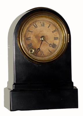 C.1875, Terry Clock Co., Waterbury, Conn., 8-day iron case timepiece. The black enamel has been rubbed down and all the design is absent. — Antique Clocks Price Guide