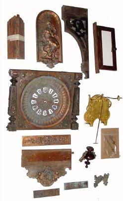 C.1890, Parts to an Ansonia "HANGING ANTIQUE", including the dial and front panel with all cast trim, — Antique Clocks Price Guide