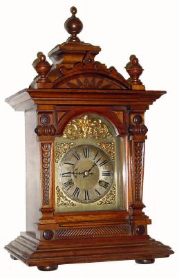 C.1920, German, Junghans, 8-day bracket clock in walnut in excellent original condition with original finials. — Antique Clocks Price Guide