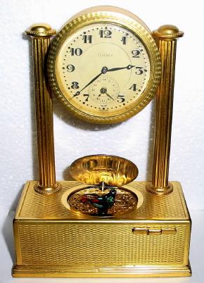 C.1935, Swiss, Brightly gilded ormolu singing bird box with integral alarm clock. — Antique Clocks Price Guide