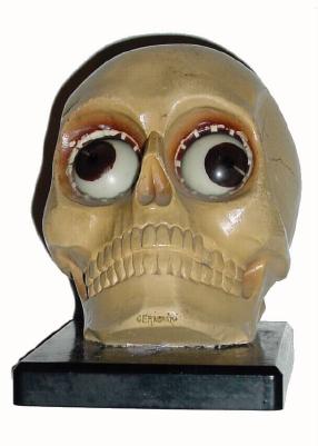 C.1920, German, "SKULL", Rotating Eye Clock, in good original condition. — Antique Clocks Price Guide