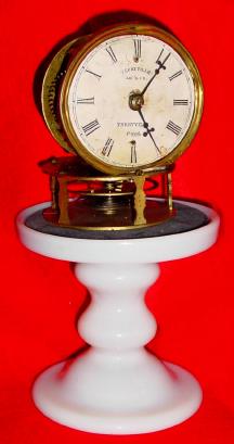 C.1853, Terryville Mfg Co., Terryville, Conn., candle stand timepiece with white paper dial and horizontal balance wheel for control of the 30 hour movement. — Antique Clocks Price Guide