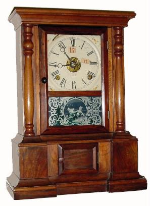 C.1868, Seem Patent Dial, on a C.1870 rosewood shelf case with a C.1900 Waterbury gingerbread movement (the rear mounting lugs were simply cut off with nippers so the movement could be block mounted) — Antique Clocks Price Guide