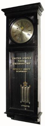 C.1905, Waltham Clock Co., "Regulator No. 14", in dark oak with special detached gravity escapement and 3 jar mercury pendulum. — Antique Clocks Price Guide