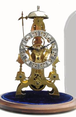 Mid 20th Century, English, Passing Strike Skeleton clock in a floral style frame designed after large inverted blue bells. — Antique Clocks Price Guide