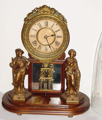 C.1880. Ansonia "Crystal Palace" , and except for an old re-paper on the dial, in very good original condition, — Antique Clocks Price Guide