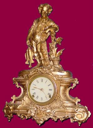 C.1860, Waterbury Clock Co.,  with Nicholas Mueller spelter case, pattern #99, boy with net and fish, with restorations (the case sprayed gold). — Antique Clocks Price Guide