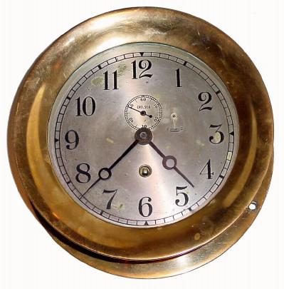 C.1930, Chelsea Clock Co., Engine Room Timepiece, in a red brass case with hinged bezel with button latch. — Antique Clocks Price Guide