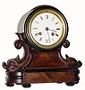 C.1890, French, walnut and ebonized, carved wood mantel clock 8-day time/strike in good condition with an original finish.