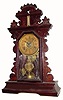 C.1885, E. Ingraham & Co., 8-day time/strike/alarm gingerbread clock in pretty good condition with a heavy coat of the varnish over the original finish.