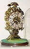 Mid 20th Century, English, Passing Strike Skeleton clock in a delicate scroll & leaf style frame with engraving on the front plate.