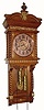 C.1904, Ansonia Clock Co., "NIOBE", oak cased wall regulator with fancy cast pendulum and twisty weights, and in excellent restored condition.
