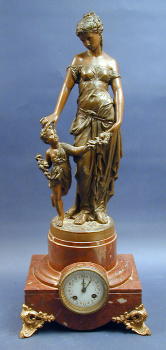 A PATINATED METAL AND MARBLE GARNITURE CLOCK. — Antique Clocks Price Guide