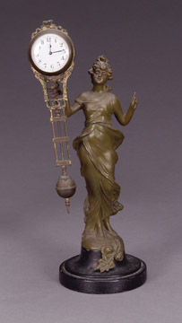 A CONTINENTAL PATINATED METAL FIGURAL FREE-SWINGER CLOCK, Late 19th/early 20th century, after a model by F(ranz) Iffland. — Antique Clocks Price Guide