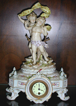 A FRENCH PORCELAIN FIGURAL MANTEL CLOCK, Late 19th/early 20th century, blue crossed lines mark for Samson. — Antique Clocks Price Guide