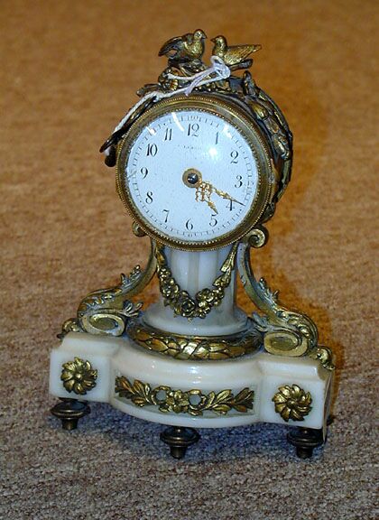 A LOUIS XVI STYLE GILT BRONZE AND ALABASTER SMALL MANTEL CLOCK, — Antique Clocks Price Guide