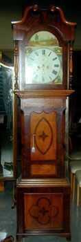 A GEORGE III INLAID OAK PROVINCIAL LONGCASE CLOCK, indecipherable signature, first quarter 19th century. — Antique Clocks Price Guide
