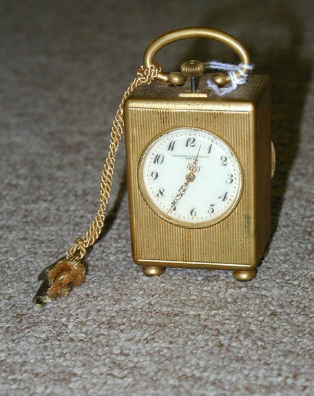 A SWISS GILT METAL SMALL CARRIAGE CLOCK, the works stamped Breve, the face inscribed Vacheron &amp; Constantin, Geneva. — Antique Clocks Price Guide