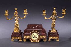 A FRENCH GILT BRONZE AND ROUGE MARBLE THREE-PIECE MANTEL GARNITURE, late 19th century. — Antique Clocks Price Guide