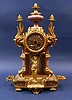 A 19th CENTURY FRENCH PORCELAIN AND DORE GARNITURE CLOCK.