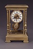 A GILT BRONZE AND 'JEWELED' MANTEL CLOCK, Early 20th century, the works by Vincenti Cie..