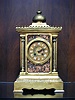 A FRENCH PARCEL-GILT AND COPPERED BRONZE MANTEL CLOCK, Late 19th century, the works by Japy Freres.
