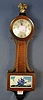 A BANJO CLOCK. Dial marked "The New Haven Clock Co.".