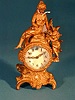 A 19TH CENTURY FIGURAL SHELF CLOCK, Works marked New Haven Clock Co.