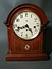 A GEORGE III STYLE MAHOGANY MANTLE CLOCK.