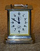A JUNGHANS CHROME AND BRASS CARRIAGE CLOCK,