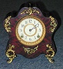 AN ANSONIA GILT METAL MOUNTED FAUX TORTIOSE MANTLE CLOCK.