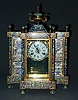 A CHINESE CLOISONNE, PORCELAIN AND BRASS MANTEL CLOCK, 20th century, bearing label 'Made in the People's Republic of China'.