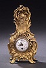 A LOUIS XV STYLE GILT METAL TABLE CLOCK, circa 1913,