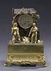 A CHARLES X GILT AND PATINATED BRONZE FIGURAL MANTEL CLOCK, circa 1830, unmarked.