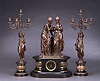A FRENCH PATINATED BRONZE AND SLATE THREE-PIECE CLOCK GARNITURE, clock by Japy Freres, late 19th century, bronze signed Dubois.