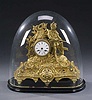 A VICTORIAN GILT METAL FIGURAL MANTEL CLOCK, mid-late 19th century.