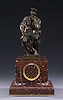 A FRENCH PATINATED BRONZE AND ROUGE MARBLE FIGURAL MANTEL CLOCK, late 19th century, movement stamped Barrard & Vignon, Paris, bronze stamped 'Cie Anonyme des Bronzes/Bruxelles'.