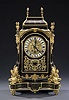 A LOUIS XIV STYLE 'BOULLE' AND GILT BRONZE MANTEL CLOCK, circa 1900, the dial engraved 'F. Lesage/Paris', the movement by Samuel Marti.