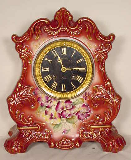 Pansy on reddish brown china case clock — Antique Clocks Price Guide