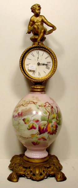 Ansonia clock with scenic and floral glass center, — Antique Clocks Price Guide