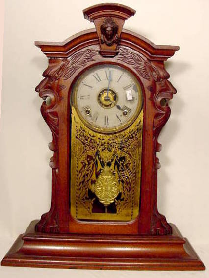 Carved walnut parlor shelf clock — Antique Clocks Price Guide