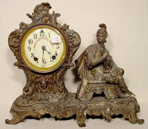 Gilbert metal statue clock — Antique Clocks Price Guide