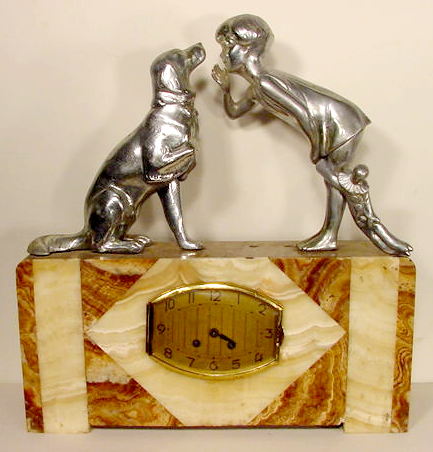 French marble and nickelled metal figural clock — Antique Clocks Price Guide