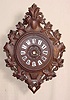Heavily carved oak hanging wall clock