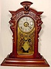 Carved walnut parlor shelf clock