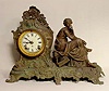Gilbert metal statue clock