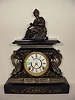 Ansonia black metal statue clock,