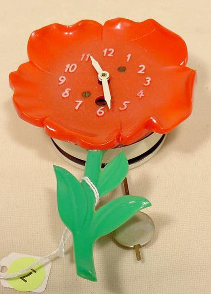 Lux plastic flower pendulette. — Antique Clocks Price Guide